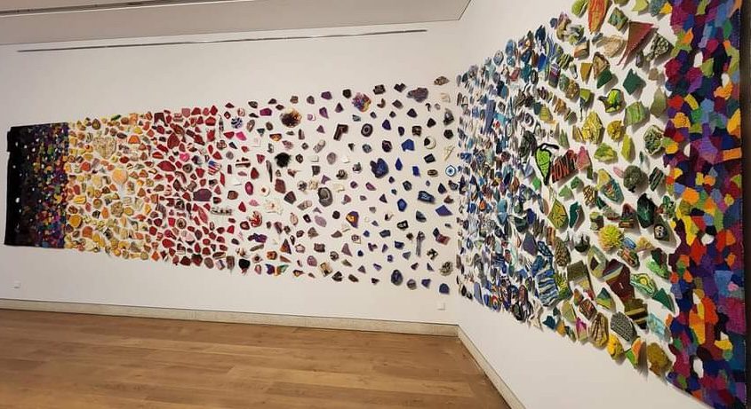 Fate, Destiny and Self-Determination is an installation conceived by Line Dufour. 1077 shapes submitted by 650 people from 44 countries, float between the two tapestry panels. It has been exhibited across the USA and Canada, Spain, Portugal, China, Uruguay, Germany, and Ireland.