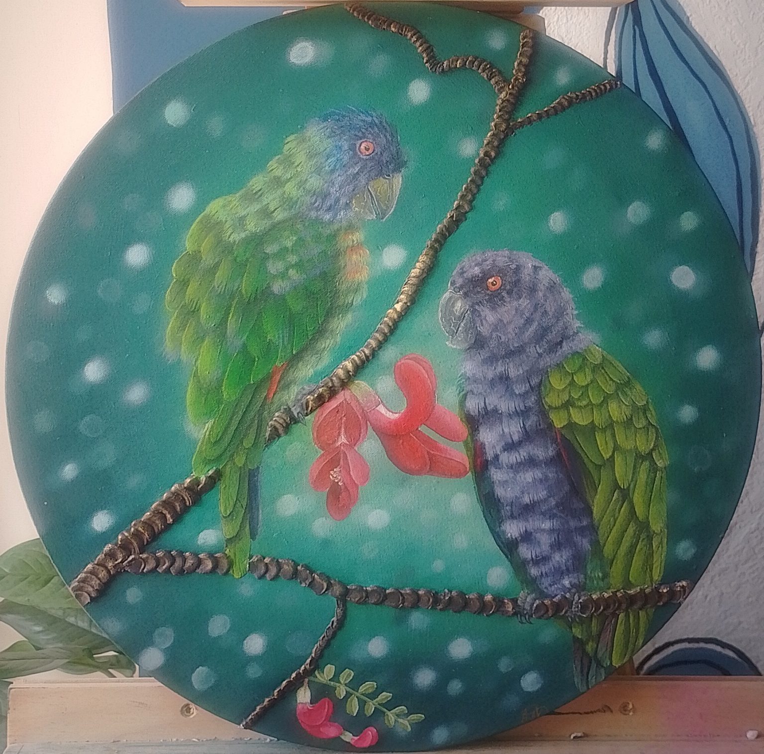 "Wings of the Nature Isle" is both a celebration and a call to stewardship. Featuring Dominica's Sisserou and Jaco parrots perched on the branches of the native Bwa Kwaib,this piece honors the flora and fauna that form an essential part of the identity and heritage of the island.