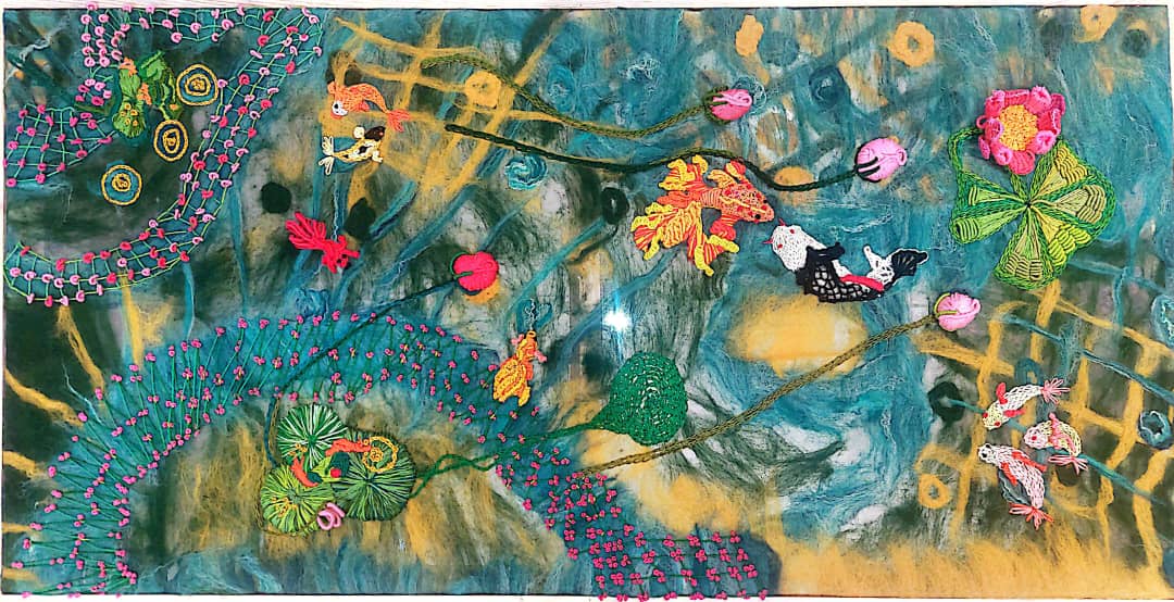 From my mixed Chinese and Indian heritage, I made this nuno-felted fiber art embroidery to share my story. Using all-natural fibers, the translucent, tactile surface shows koi and lotus, bringing together a gentle message of harmony, acceptance, and peace.