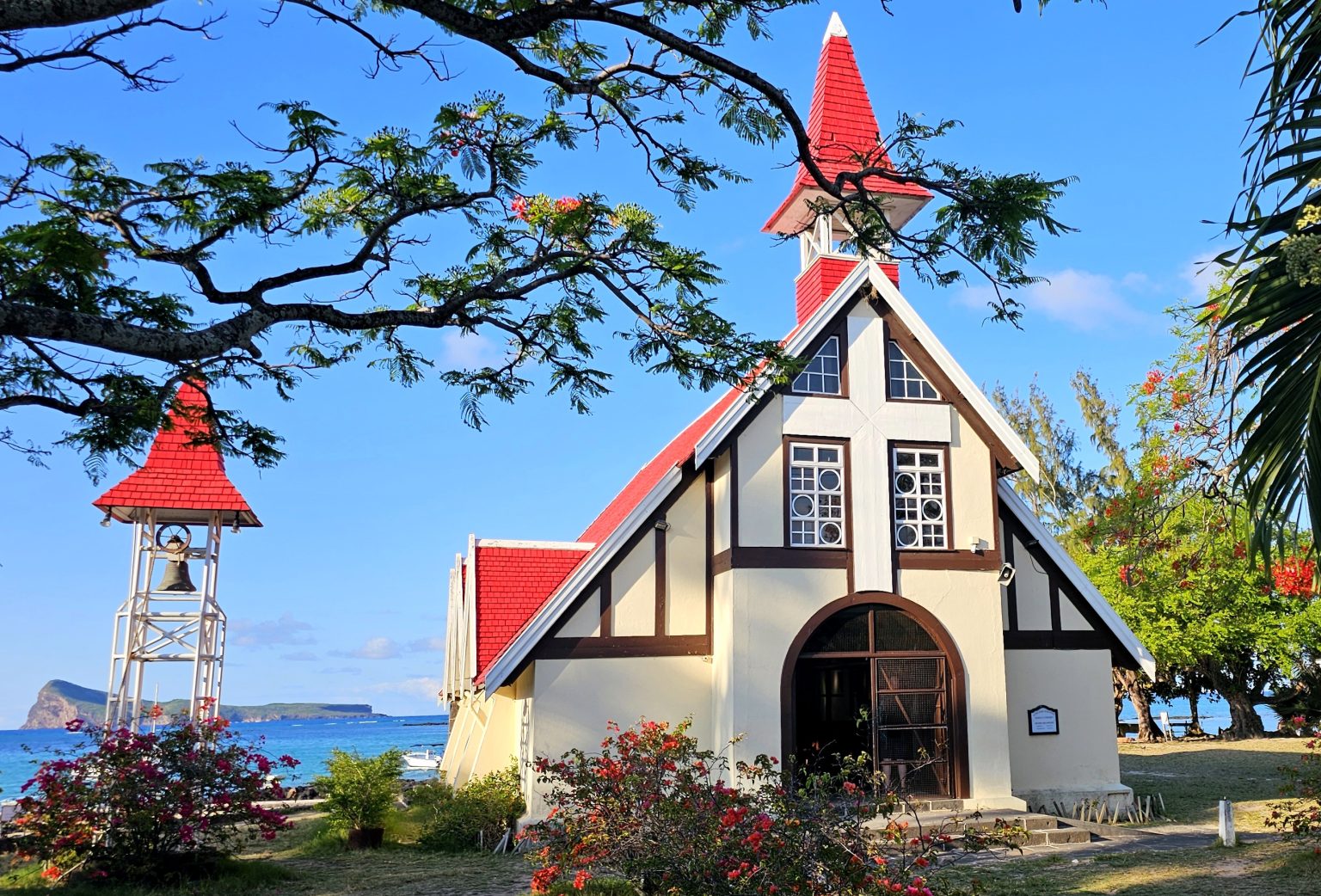 Overlooking the Indian Ocean, Notre Dame Auxiliatrice at Cap Malheureux, Mauritius stands as an iconic landmark where heritage, faith and natural beauty converge. Witness of the war between French and British, it reflects the island's resilience, diversity & sense of harmony.